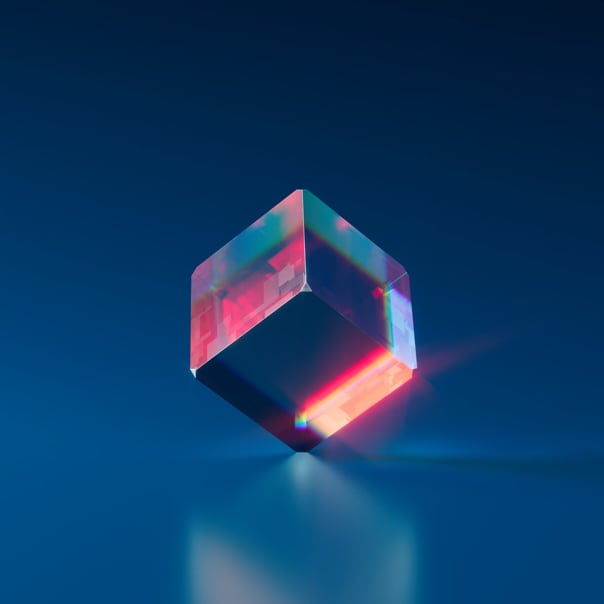 A colored cube balanced on one of it`s corners